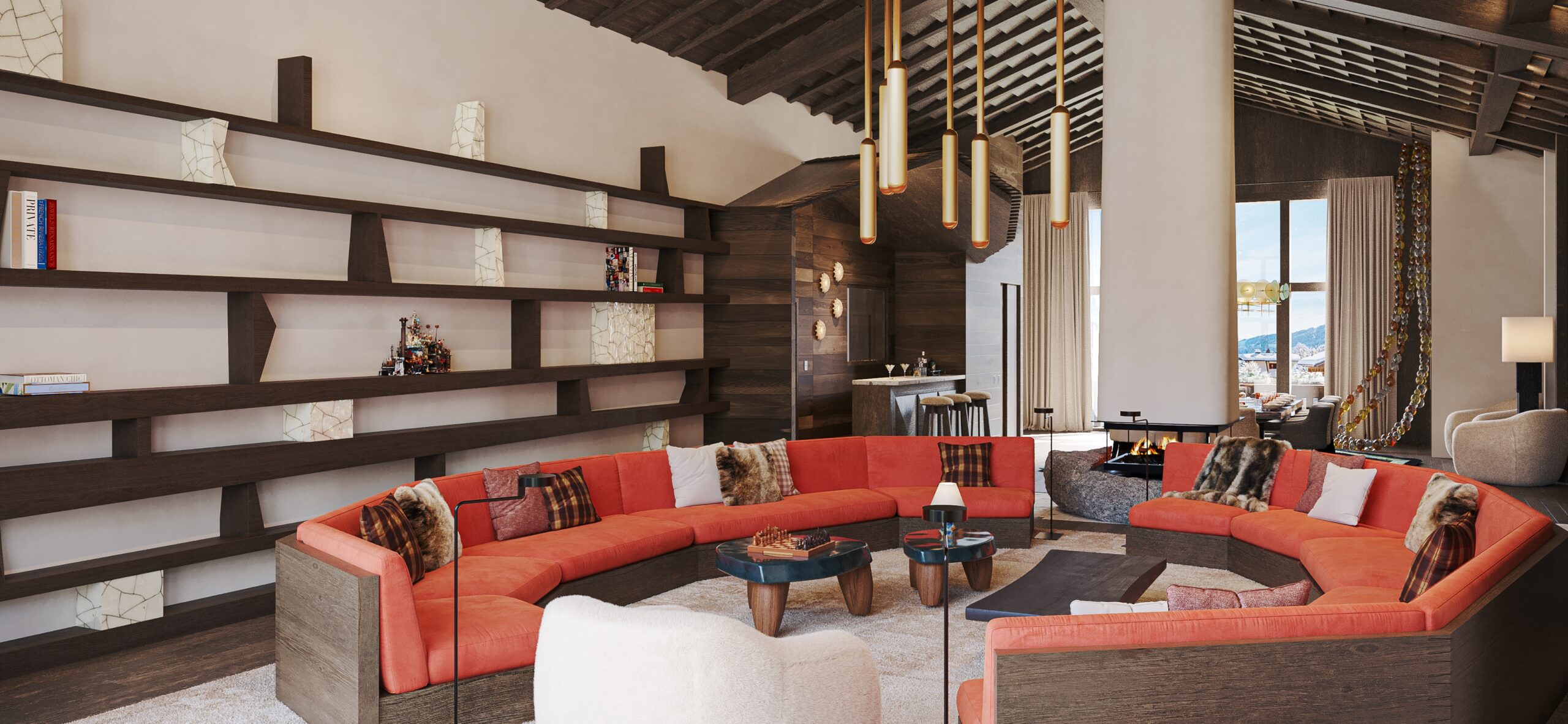 Studio Chalet interior with a large orange circular sofa and a central fireplace