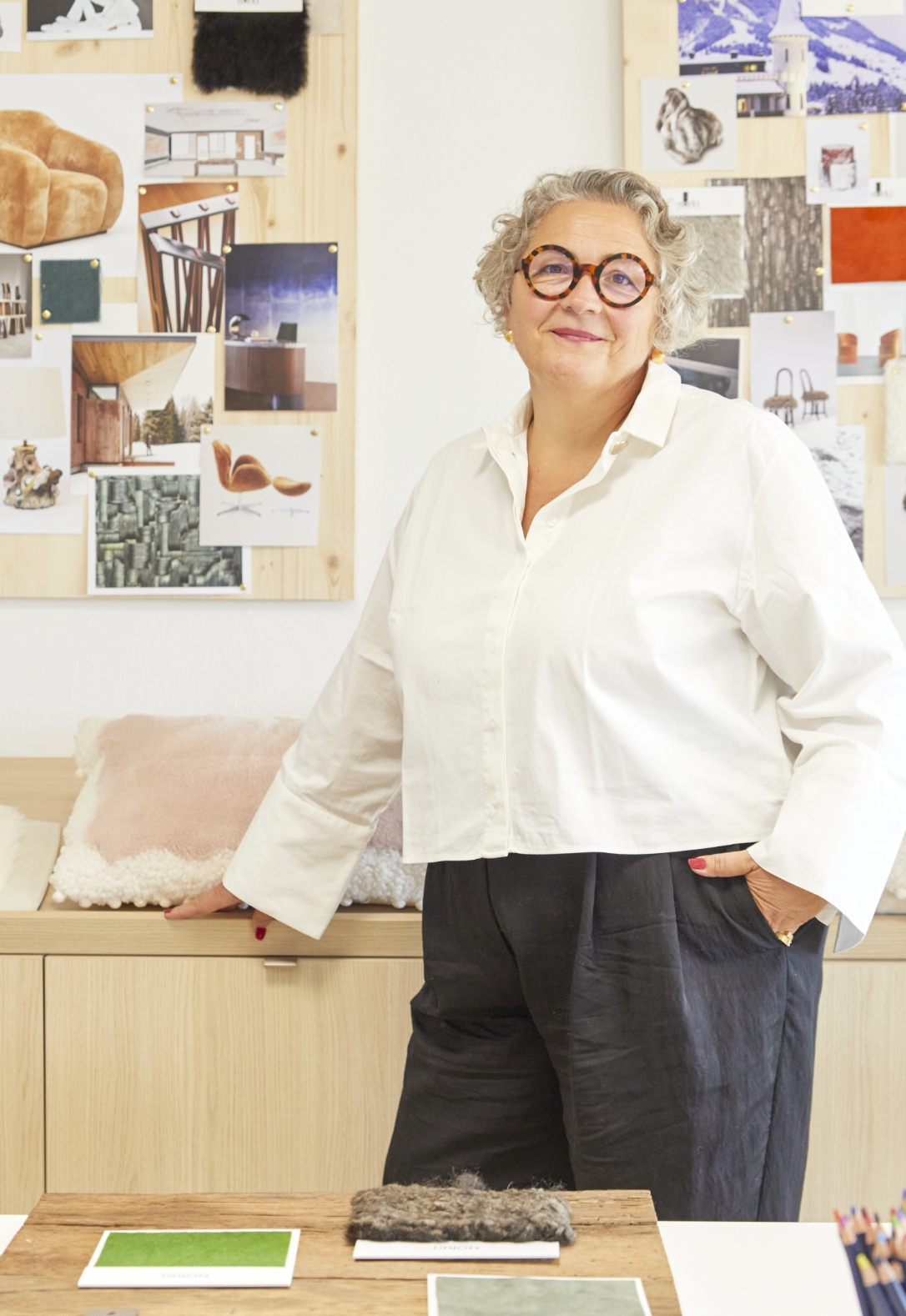 Portrait of Sonia Linard in front of a moodboard