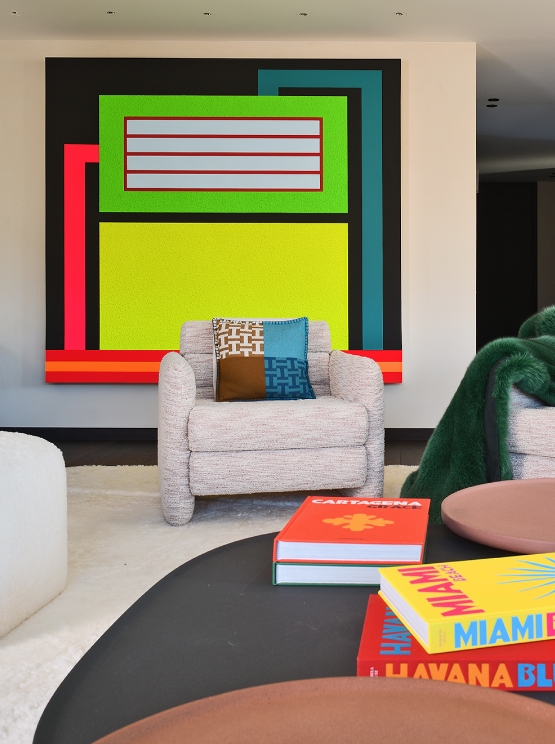 Bright interior with colorful artworks and designer furniture