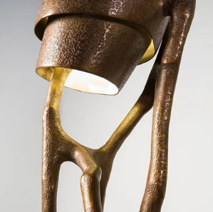 Sculptural bronze wall sconce or lamp