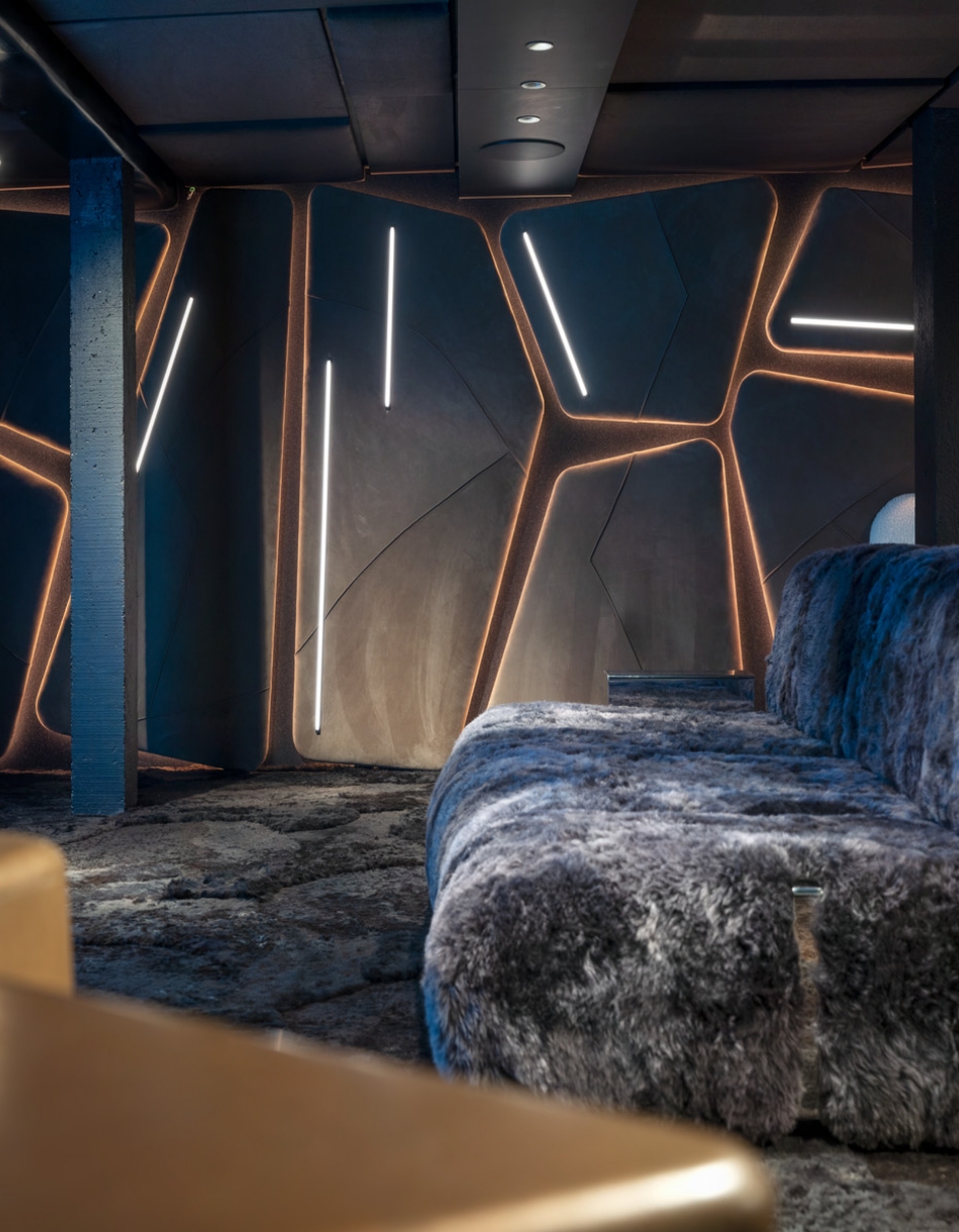 Interior design of a luxurious home cinema in a chalet in Megève, with fur sofas