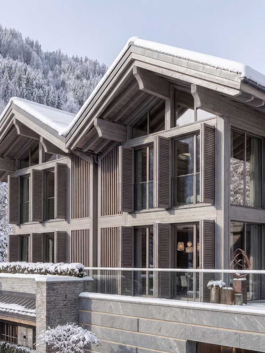 Contemporary exterior façade of a luxury chalet in Courchevel, blending local stone and grey-toned wood