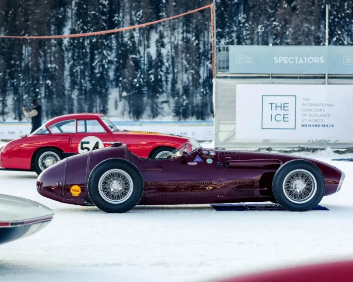 Vintage burgundy car on snow
