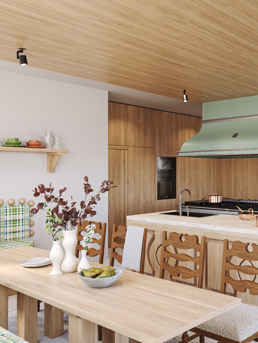 Cuisine luxueuse en bois clair avec éléments de cuisson verts pastel et salle à manger attenante