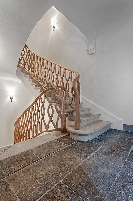 Monumental stone staircase and carved railing for the exceptional chalet in St. Moritz
